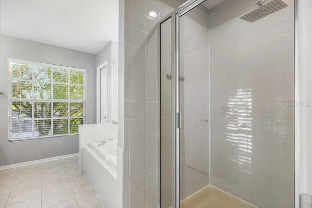 a bathroom with a granite countertop sink and a large mirror