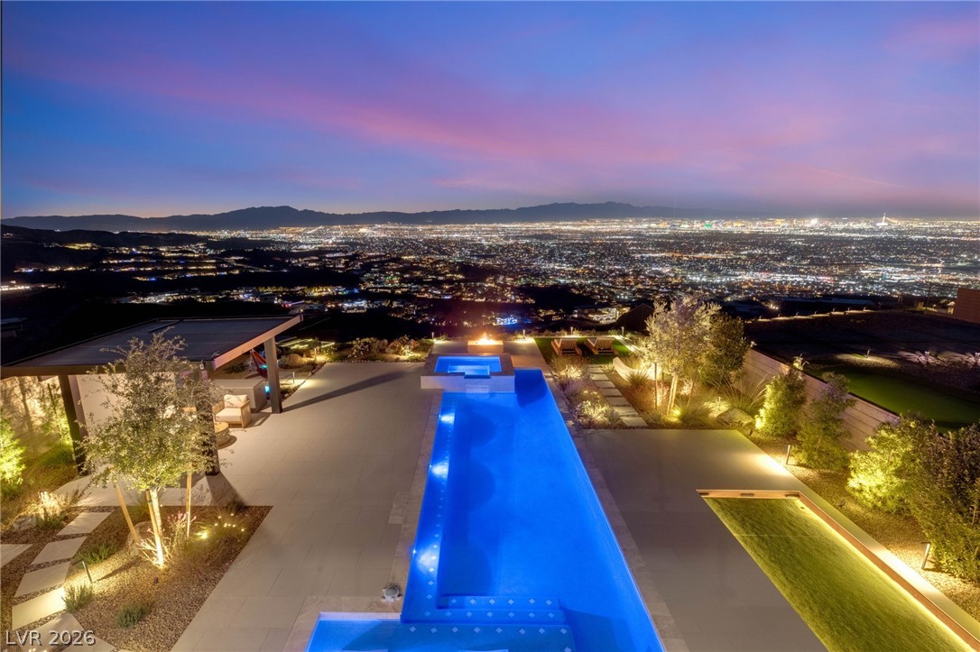 571 Overlook Rim Drive Henderson, NV 89012 - Photo 74 of 85 Integrated pool / hot tub with a mountain view and a patio
