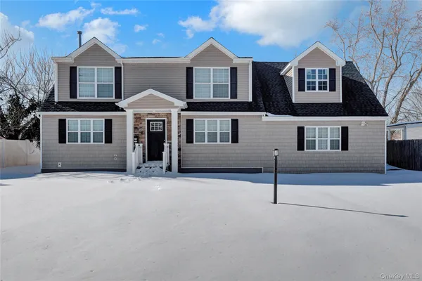 a front view of a house with yard