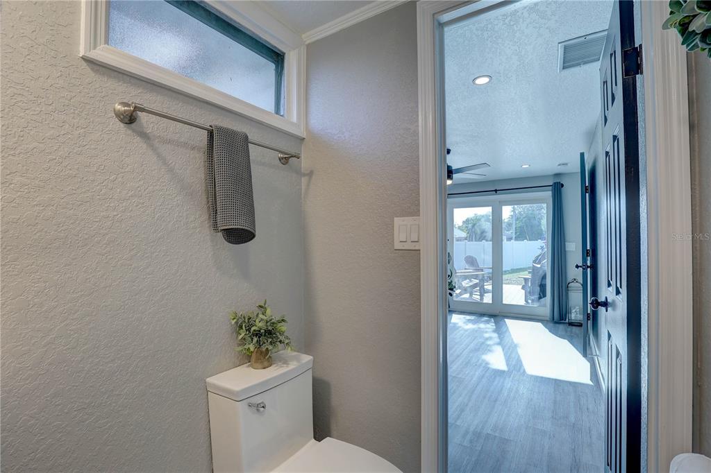 8201 Ridge Road Seminole, FL 33772 - Photo 22 of 36 a bathroom with a bathtub shower sink and toilet