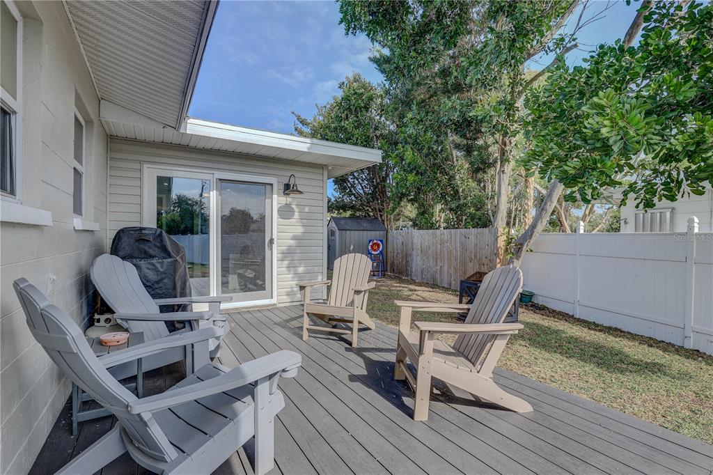 8201 Ridge Road Seminole, FL 33772 - Photo 25 of 36 a wooden bench sitting in front of a house