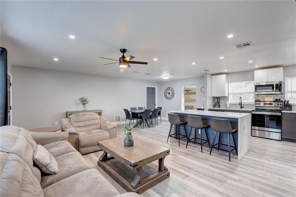 8201 Ridge Road Seminole, FL 33772 - Photo 10 of 36 a living room with furniture and kitchen view