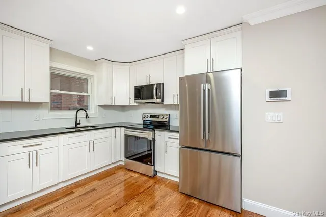 a view of a kitchen and a window
