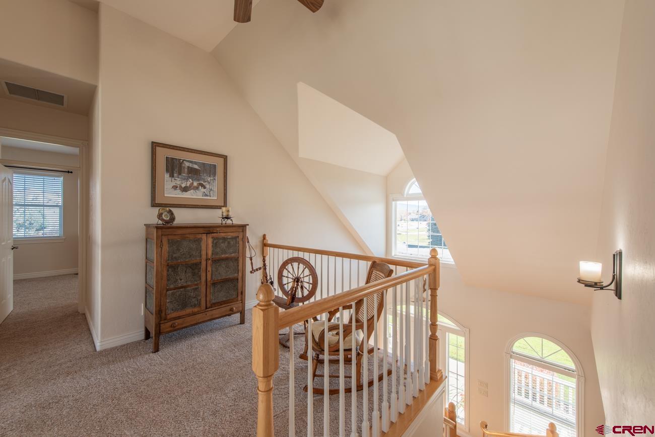 68020 Tumbleweed Road Montrose, CO 81403 - Photo 34 of 45 a view of a hallway with workspace