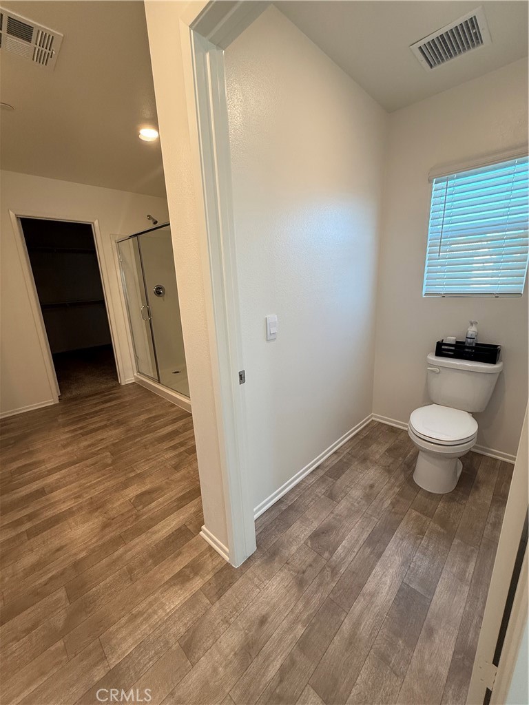 479 Hollyhock Circle San Jacinto, CA 92582 - Photo 12 of 36 a bathroom with a sink and a toilet