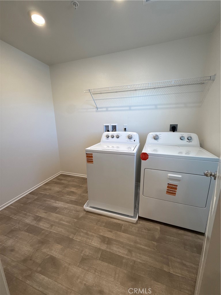 479 Hollyhock Circle San Jacinto, CA 92582 - Photo 16 of 36 a utility room with dryer and washer