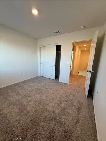 an empty room with a mirror