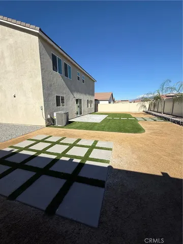 a view of yard with swimming pool