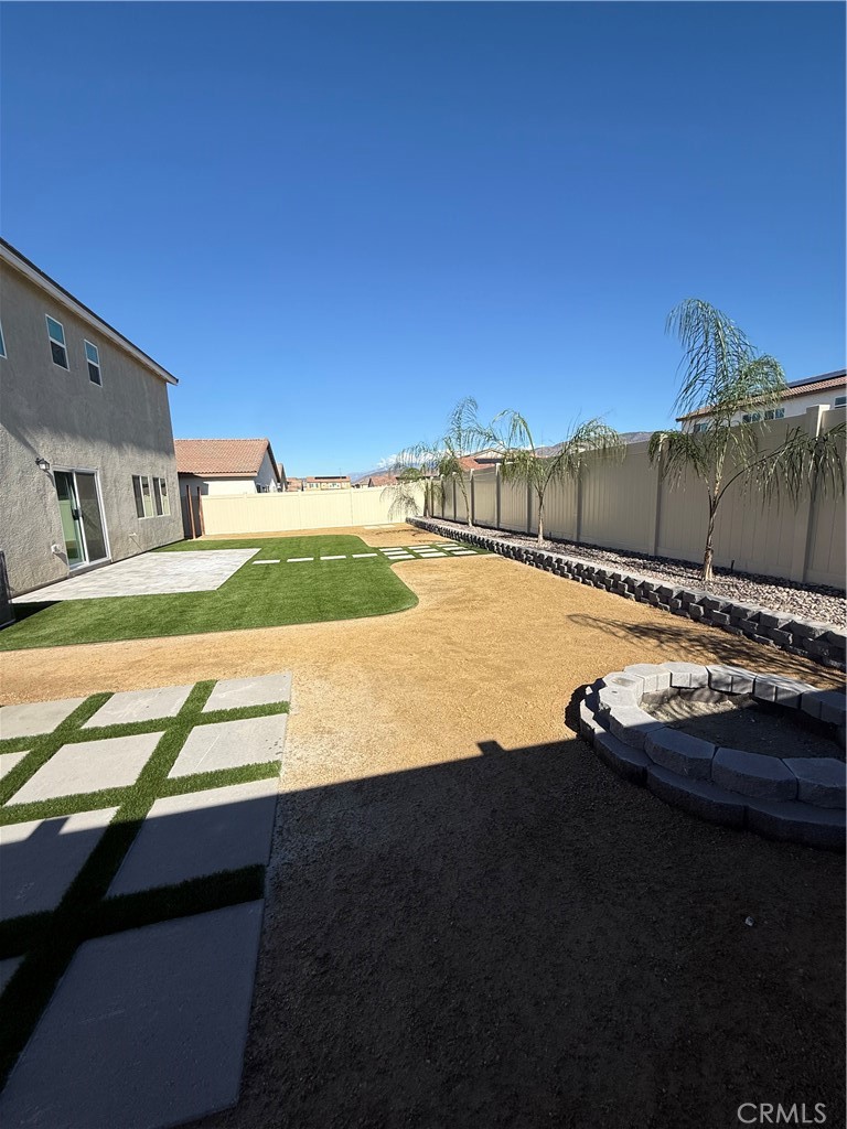 479 Hollyhock Circle San Jacinto, CA 92582 - Photo 23 of 36 a view of a swimming pool with a yard