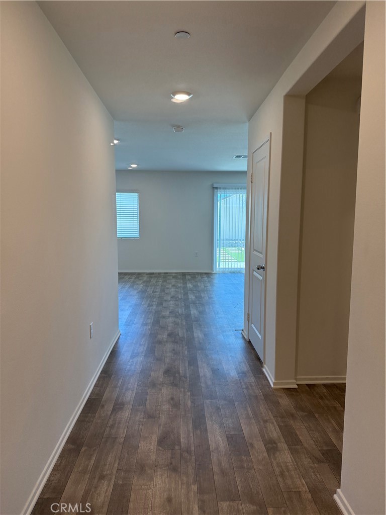 479 Hollyhock Circle San Jacinto, CA 92582 - Photo 3 of 36 a view of a livingroom with wooden floor