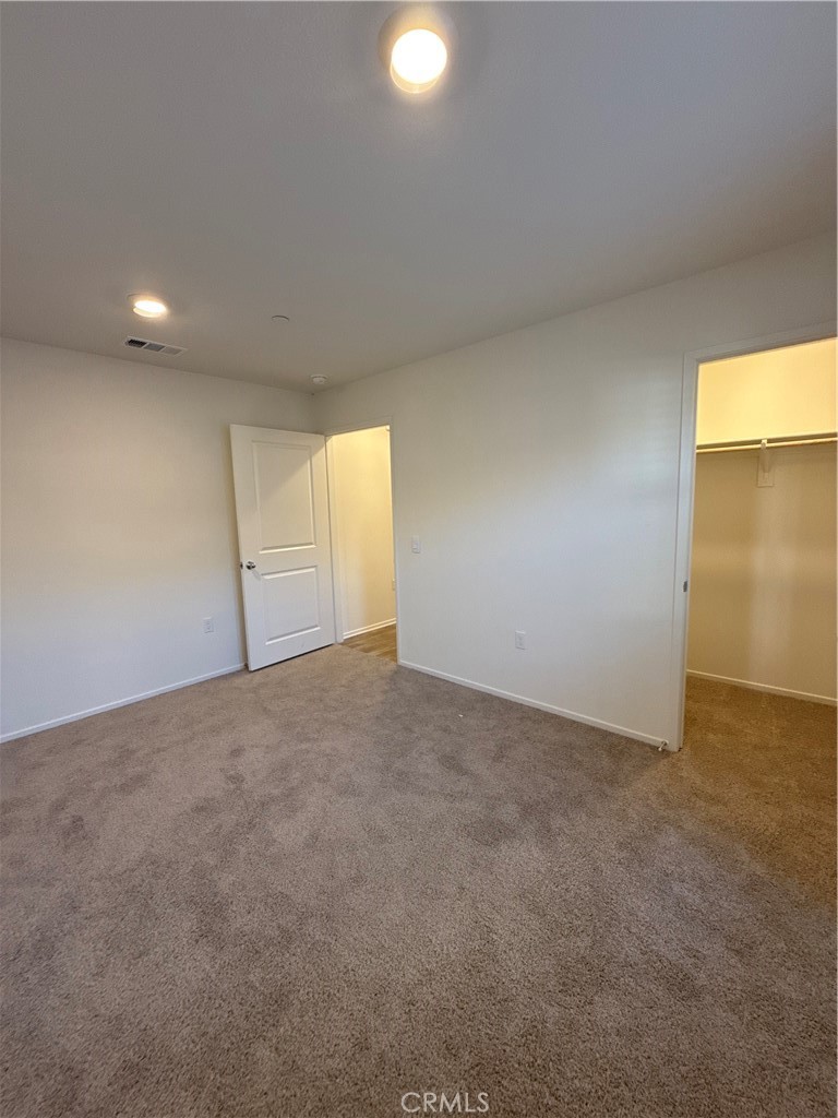479 Hollyhock Circle San Jacinto, CA 92582 - Photo 32 of 36 a view of an empty room with a window