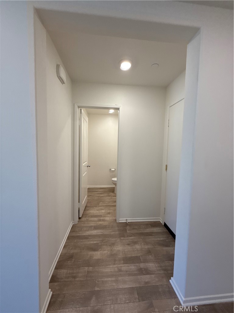 479 Hollyhock Circle San Jacinto, CA 92582 - Photo 4 of 36 a view of hallway with wooden floor