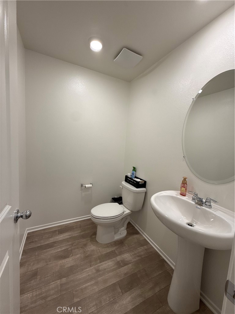 479 Hollyhock Circle San Jacinto, CA 92582 - Photo 5 of 36 a bathroom with a sink and a toilet