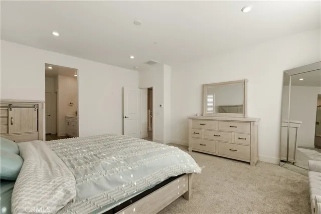 a bathroom with double vanity sink and a mirror