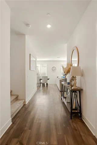 a view of a livingroom with furniture and hardwood floor