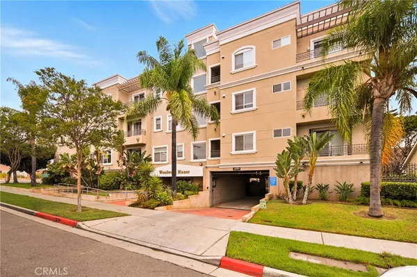 a front view of a building with a yard