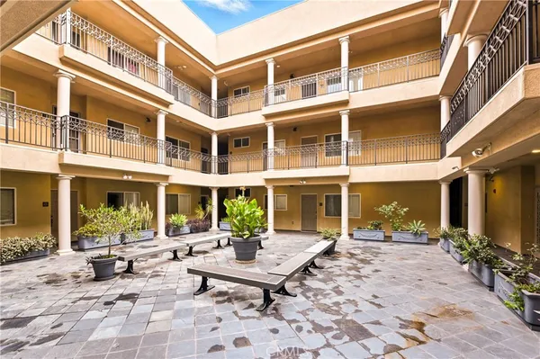 a view of a building with sitting area