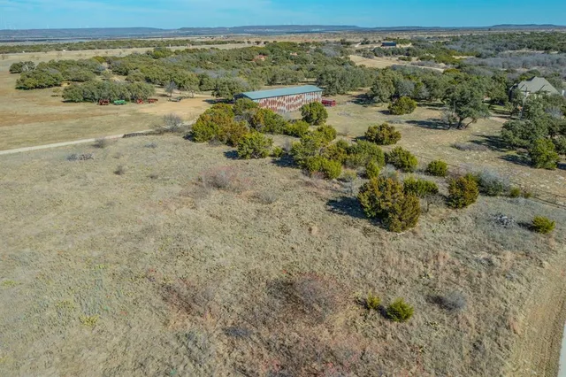 an aerial view of beach and yard