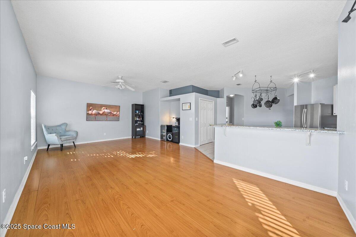 7469 Hackberry Road Cocoa, FL 32927 - Photo 11 of 27 a view of a kitchen with furniture and a kitchen