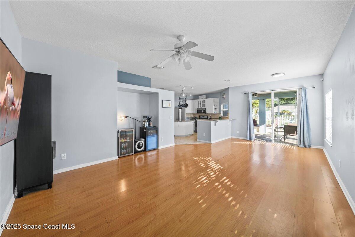 7469 Hackberry Road Cocoa, FL 32927 - Photo 12 of 27 a view of an empty room with window and cabinet