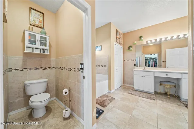 a bedroom with a bed and a desk