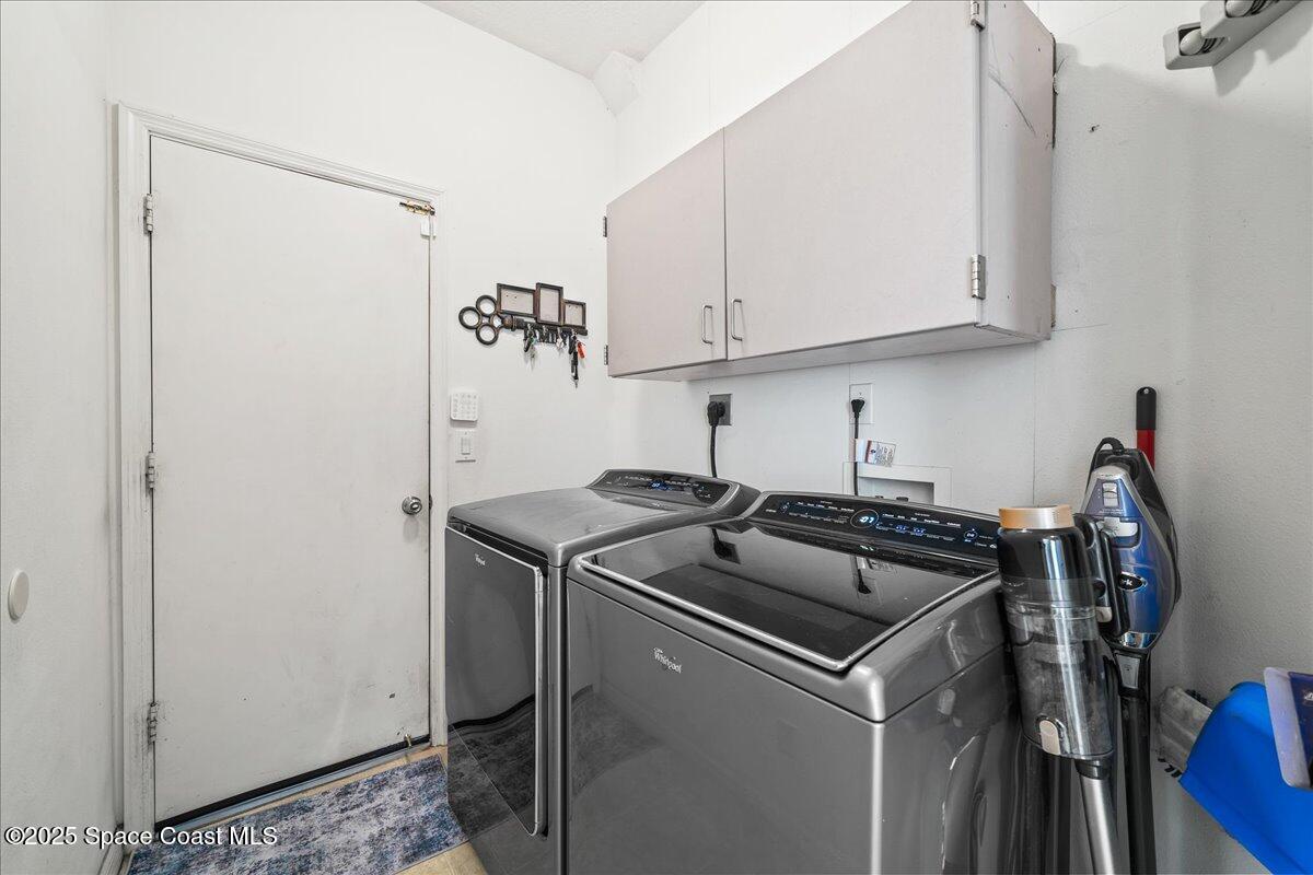 7469 Hackberry Road Cocoa, FL 32927 - Photo 21 of 27 a kitchen with a sink and cabinets