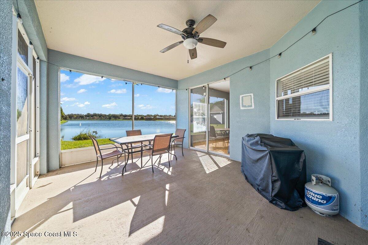 7469 Hackberry Road Cocoa, FL 32927 - Photo 22 of 27 a living room with furniture and a large window