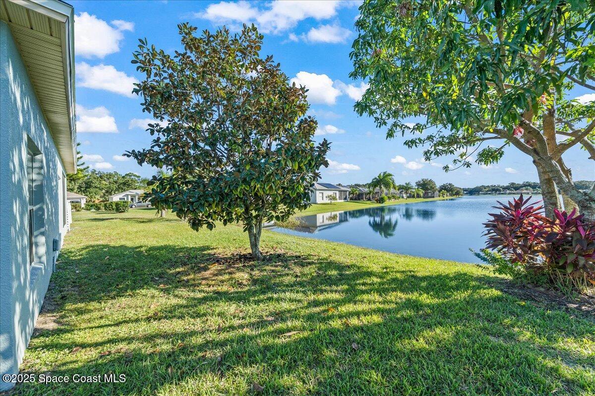 7469 Hackberry Road Cocoa, FL 32927 - Photo 26 of 27 a swimming pool with wooden fence