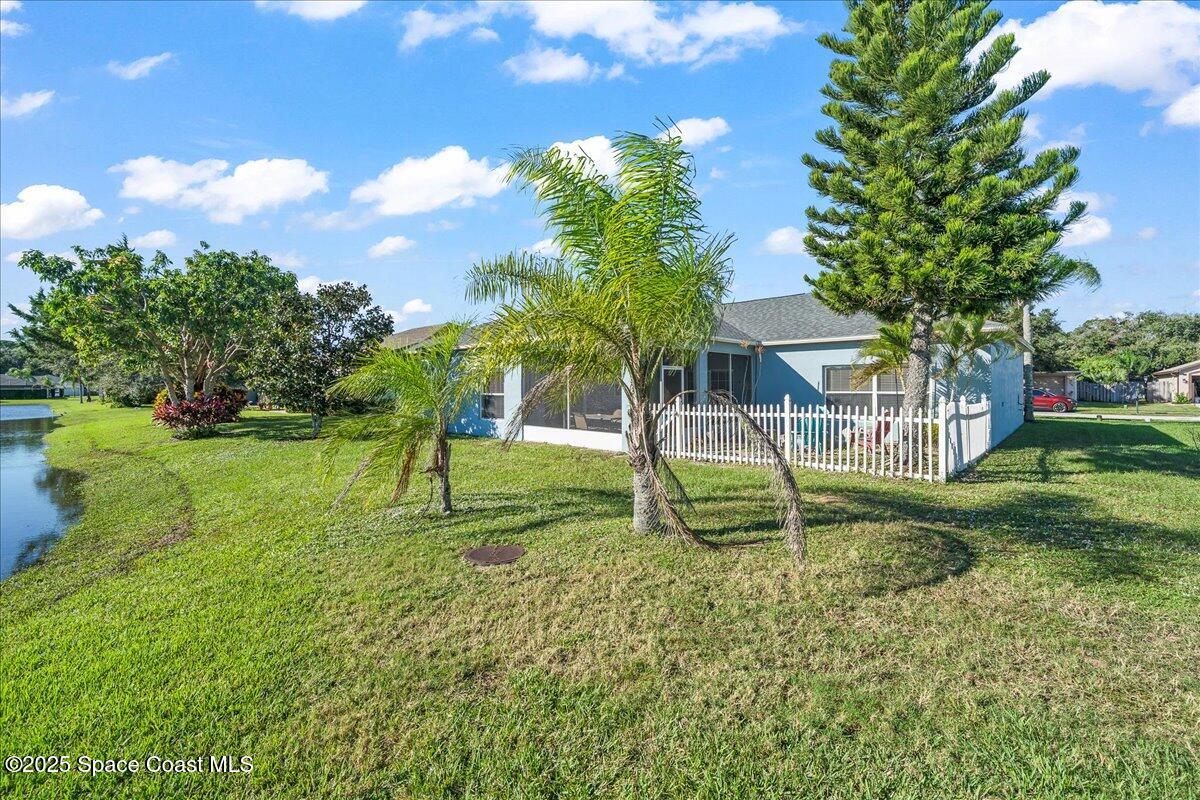 7469 Hackberry Road Cocoa, FL 32927 - Photo 27 of 27 a view of a house with a yard