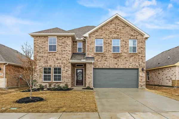 a front view of a house with yard