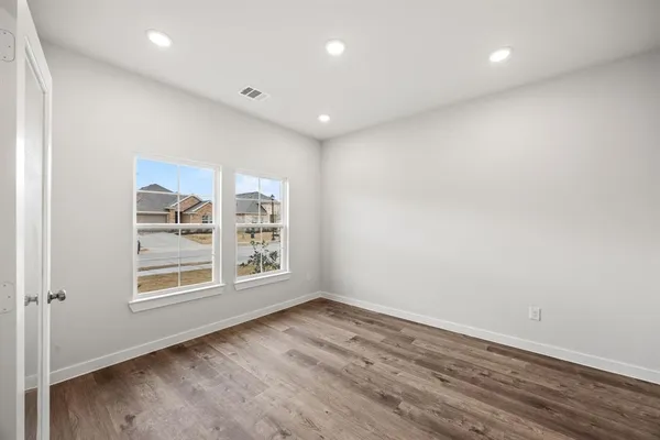 an empty room with windows