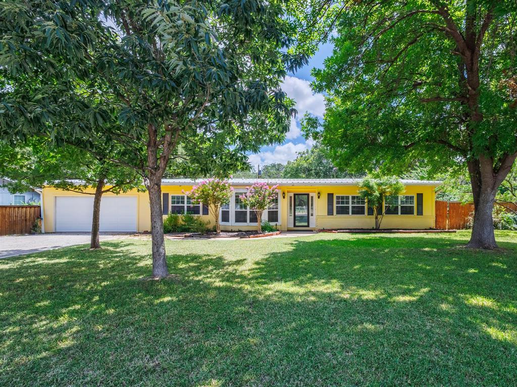 4002 Austin Avenue Brownwood, TX 76801 - Photo 1 of 34 a front view of house with yard and green space