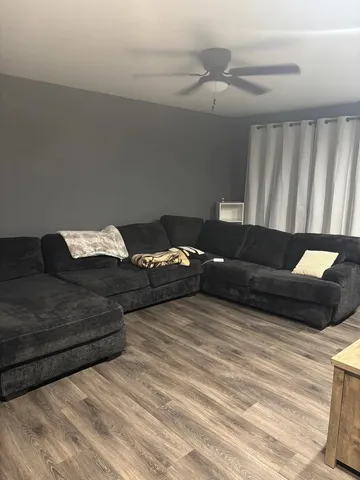 a bathroom with a granite countertop toilet and a sink