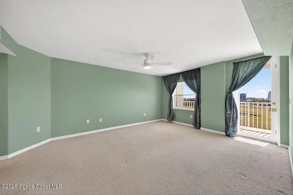 a view of an empty room with a window