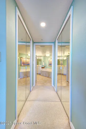 an empty room with windows and entrance