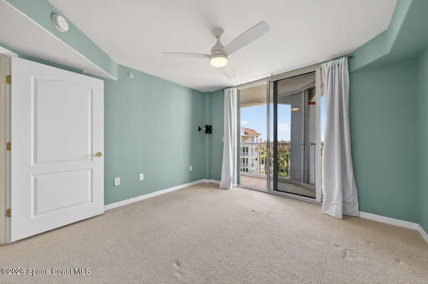 a spacious bathroom with a double vanity sink a mirror and a toilet
