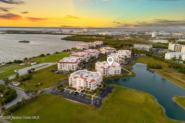 an aerial view of a house with a ocean view