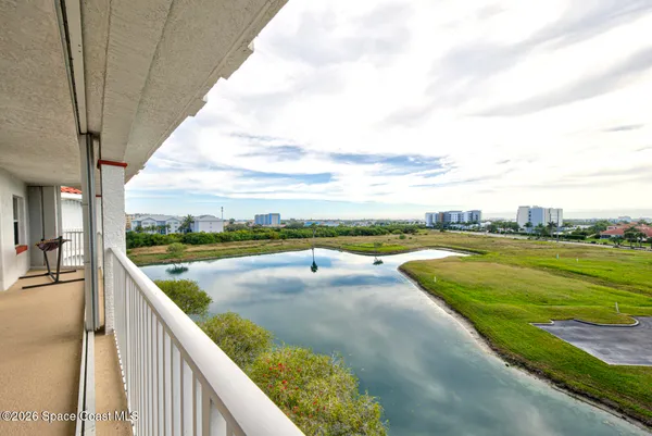 a view of parking garage with cars