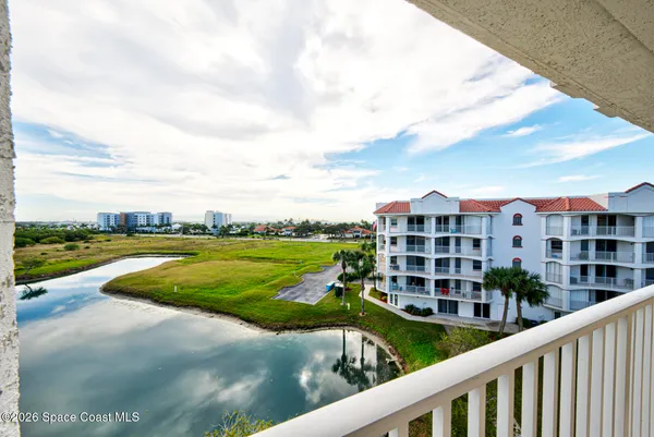 a front view of a house with a yard and porch