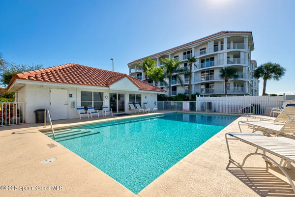 a view of a swimming pool with a garden