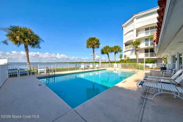a view of a lake with houses in the back