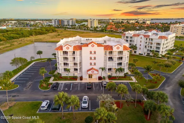 a sign board with a park bench sitting in the middle of a park