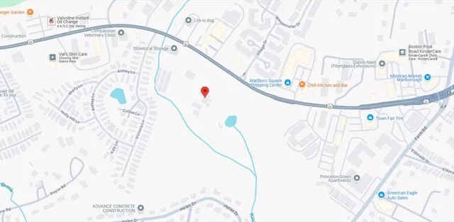 a close up of a white wall with a view of swimming pool