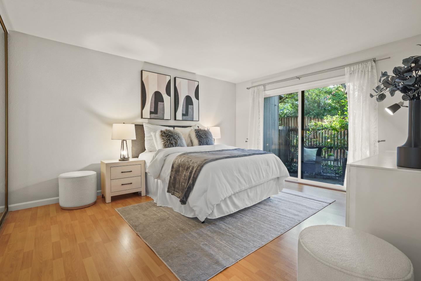 928 Wright Avenue, Unit 1005 Mountain View, CA 94043 - Photo 11 of 25 a spacious bedroom with a bed and a large window