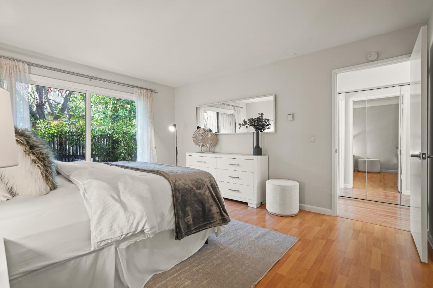 928 Wright Avenue, Unit 1005 Mountain View, CA 94043 - Photo 13 of 25 a bedroom with a bed and a large window