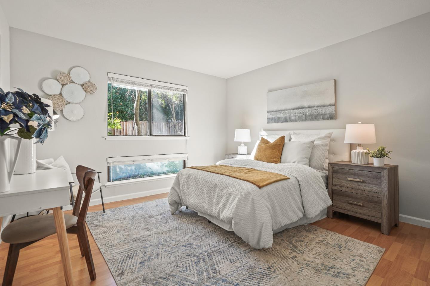 928 Wright Avenue, Unit 1005 Mountain View, CA 94043 - Photo 14 of 25 a bedroom with a bed and a chair