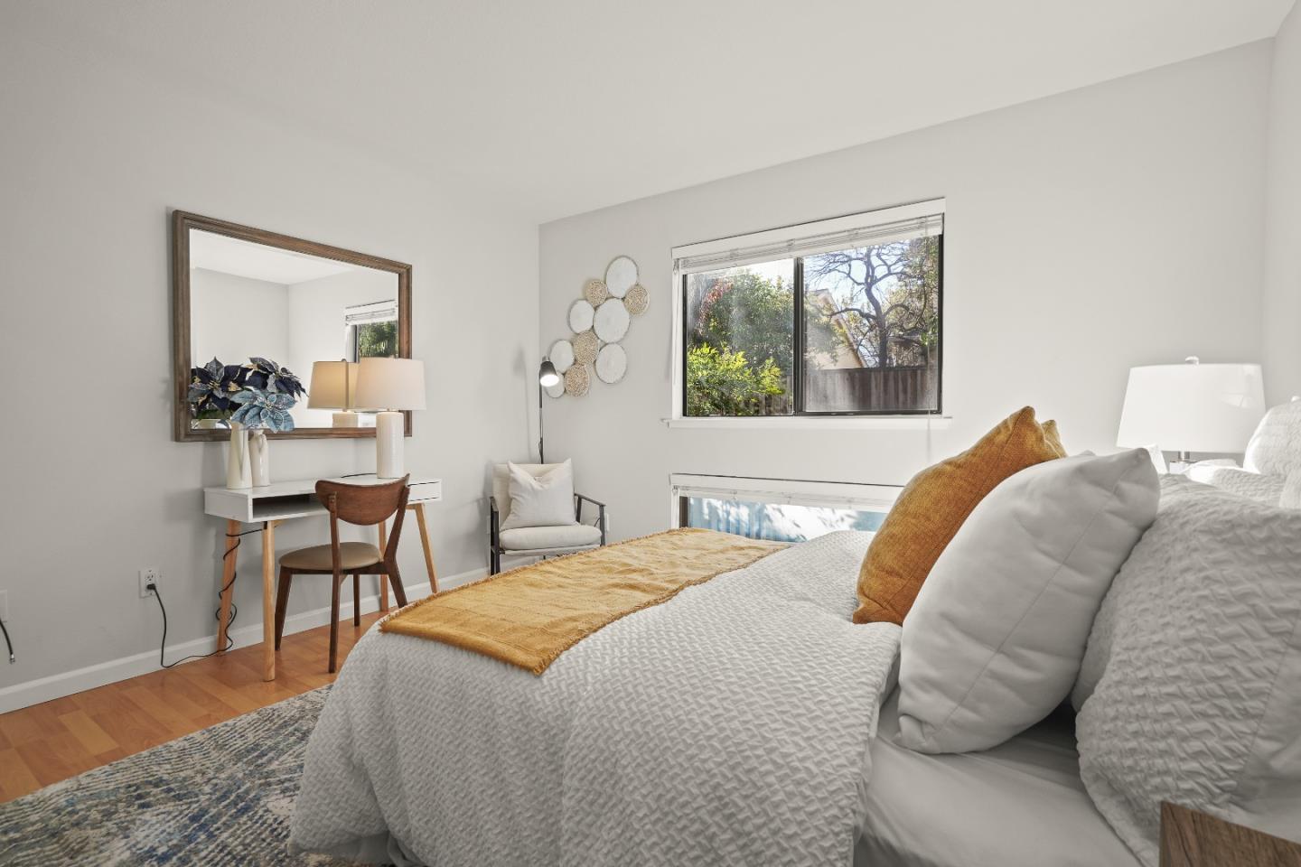 928 Wright Avenue, Unit 1005 Mountain View, CA 94043 - Photo 15 of 25 a bedroom with a bed and wooden floor