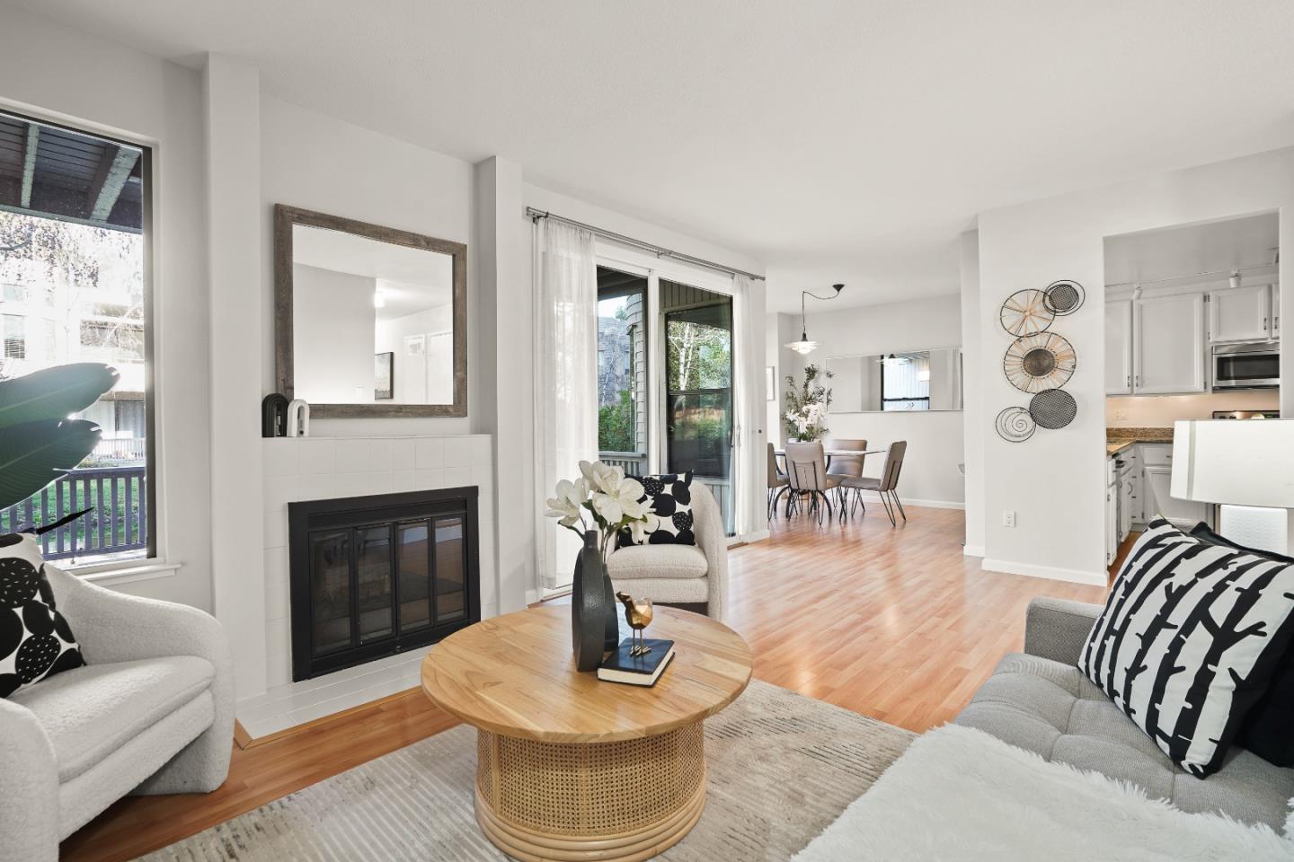 928 Wright Avenue, Unit 1005 Mountain View, CA 94043 - Photo 3 of 25 a living room with furniture fireplace and a large window