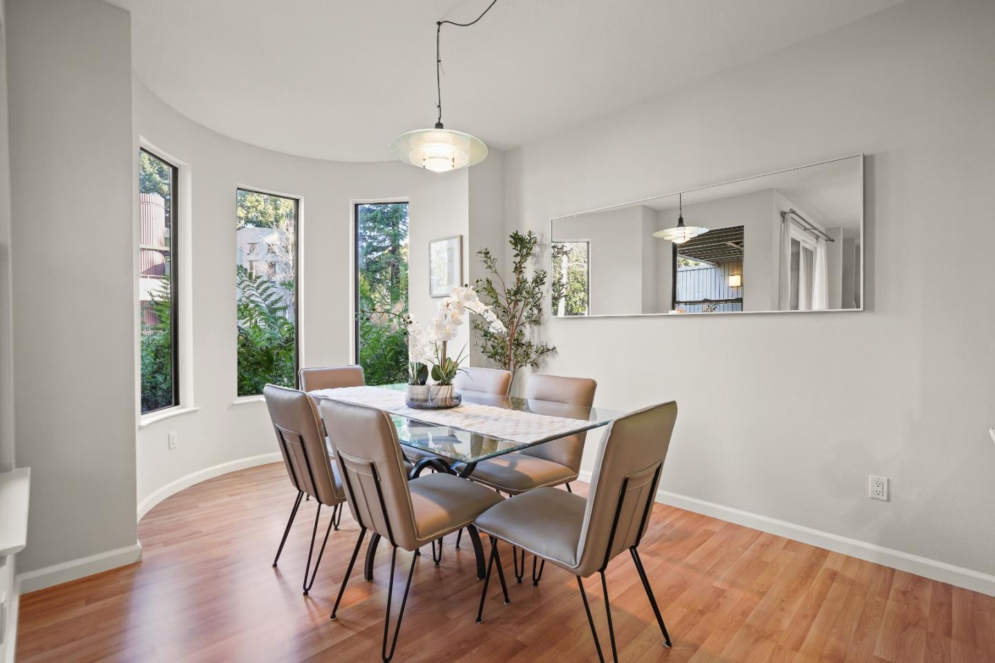 928 Wright Avenue, Unit 1005 Mountain View, CA 94043 - Photo 5 of 25 a view of a dining room with furniture window and wooden floor