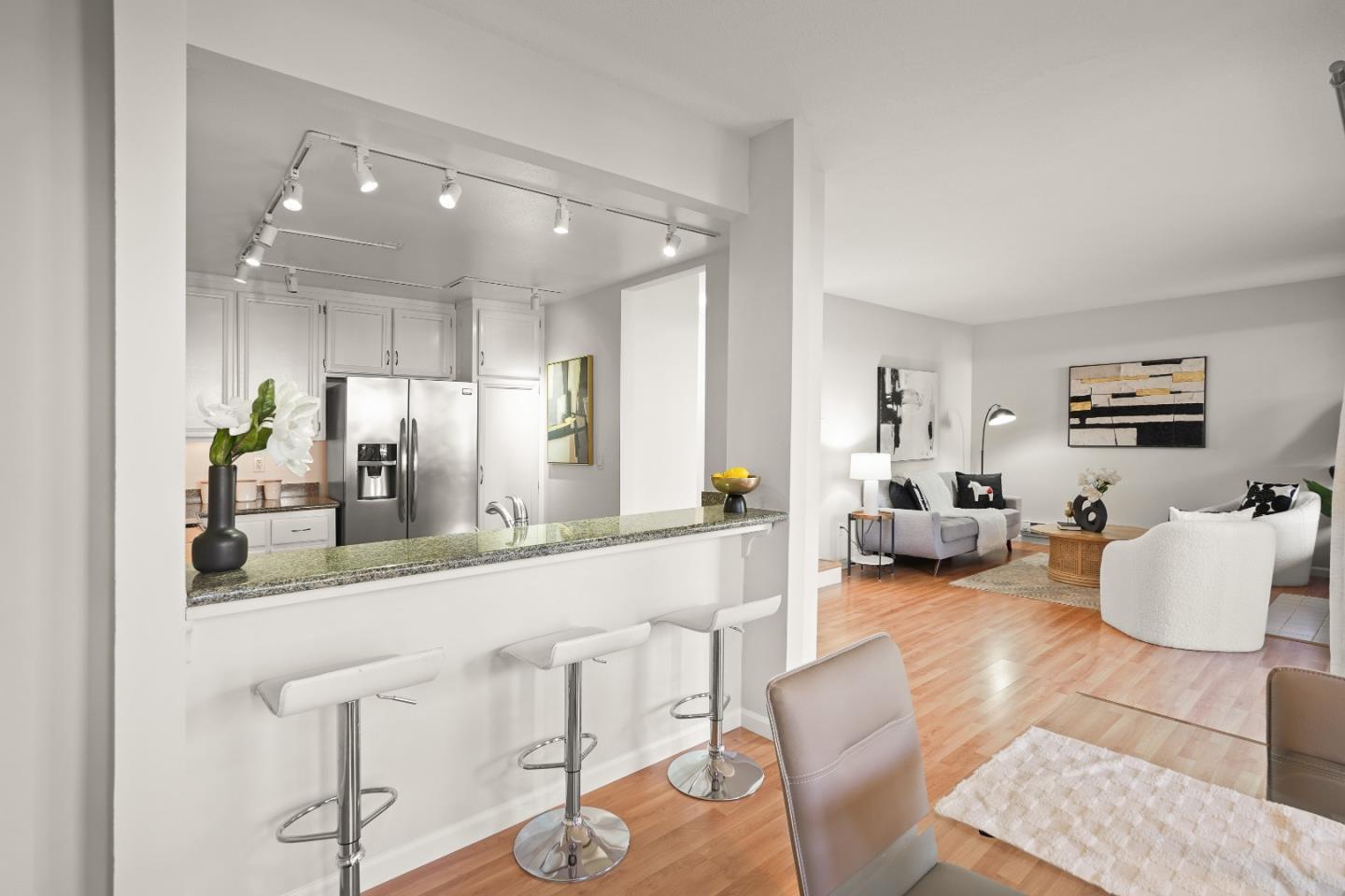 928 Wright Avenue, Unit 1005 Mountain View, CA 94043 - Photo 7 of 25 a living room with furniture and kitchen view